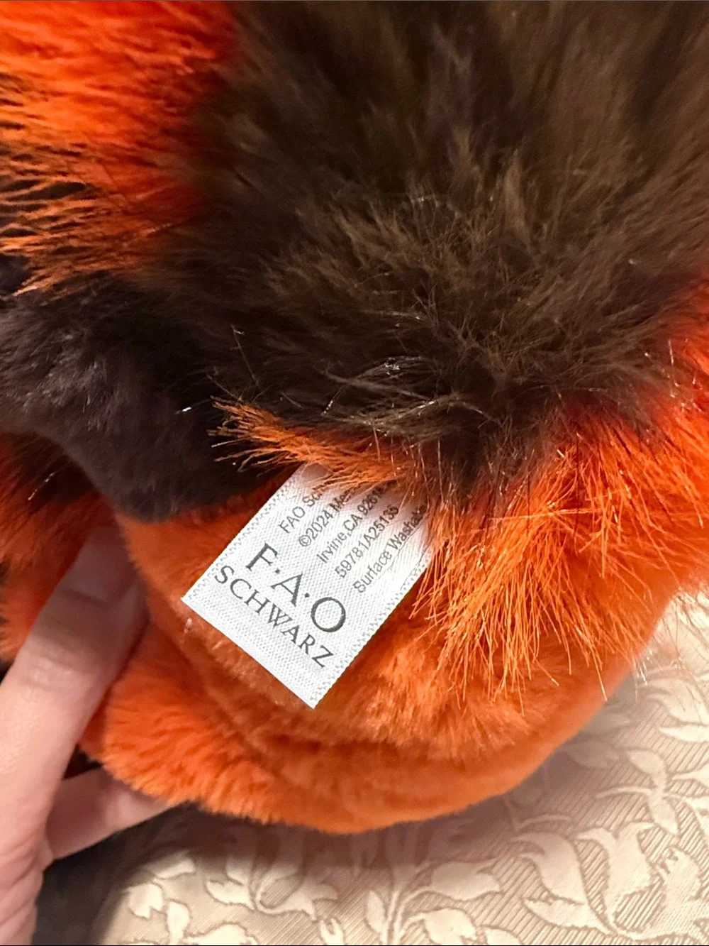 BNWT FAO Schwarz Orange and Black Sleeping Red Panda Plush.